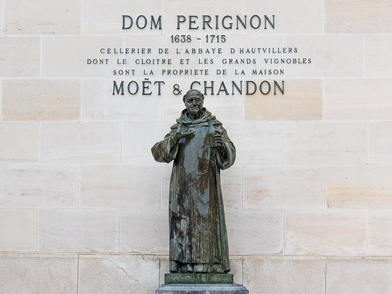 The statue of Dom Pérignon beneath the Moët & Chandon inscription