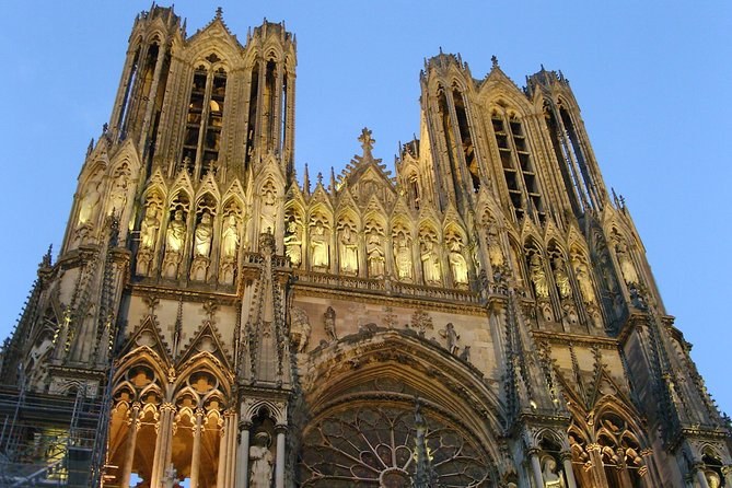 Reims Cathedral's west front and towers lit by the sun