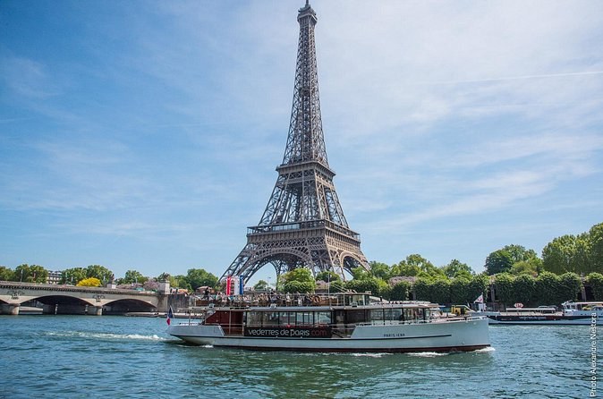 A tour boat on the Seine below the Eiffel Tower